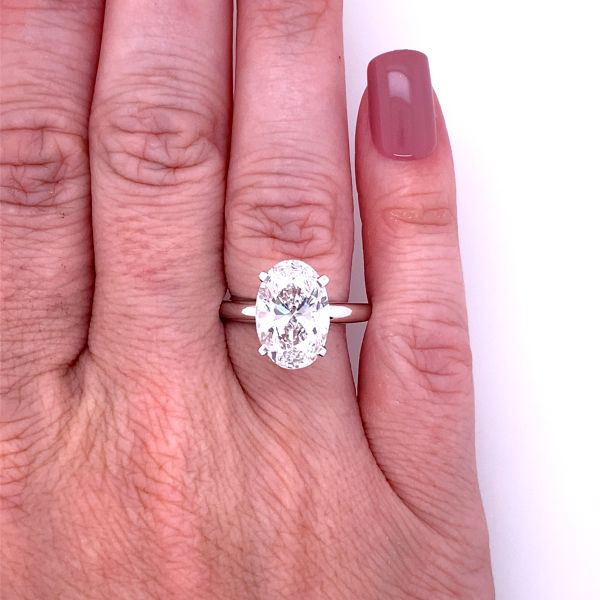 Lab Grown DIamond Oval Solitaire Ring White Gold Front Picture in a hand 