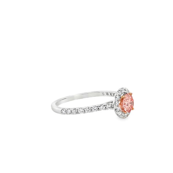 lab grown diamond ring with fancy pink diamond in the center and halo with white diamonds in 14k white gold side picture
