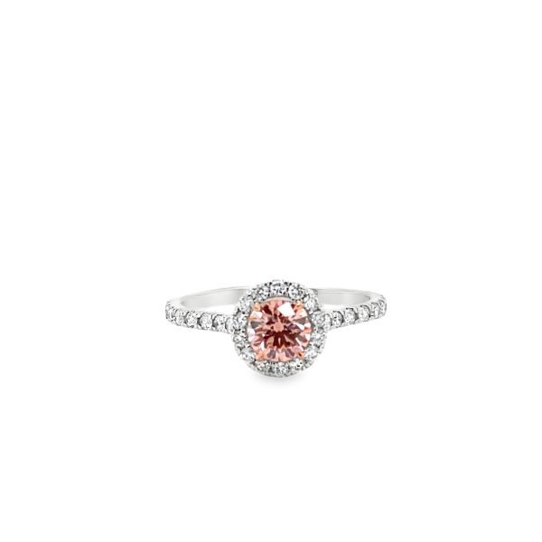 lab grown diamond ring with fancy pink diamond in the center and halo with white diamonds in 14k white gold