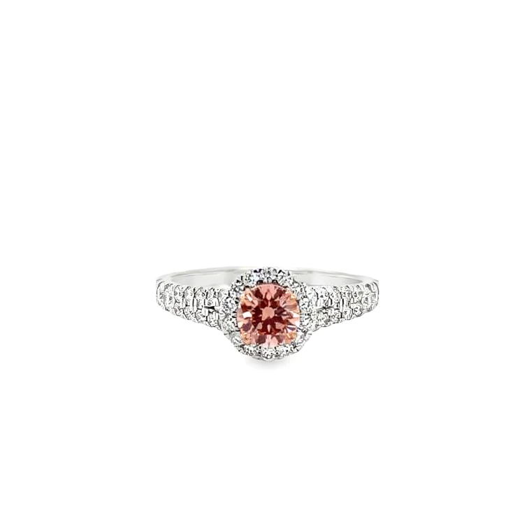 lab grown diamond ring with  round cut pink diamond in the center and halo with white diamonds in 14k white gold