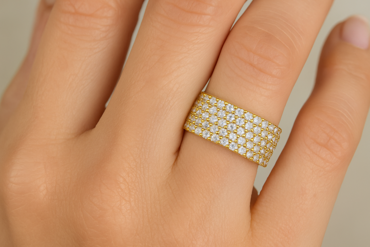 5 rows lab grown Diamond ring in 10k yellow gold on hand.