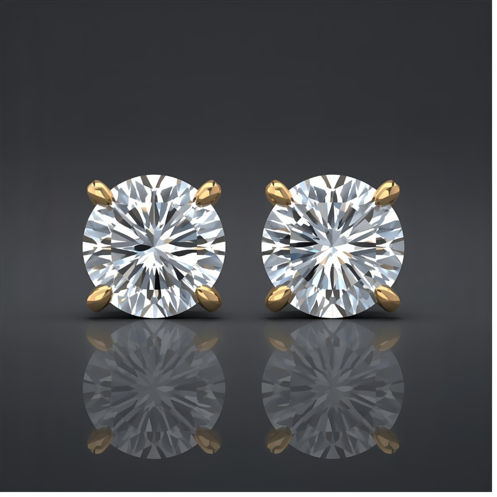 Pair of lab grown diamond stud earrings with gold prongs on a reflective surface.