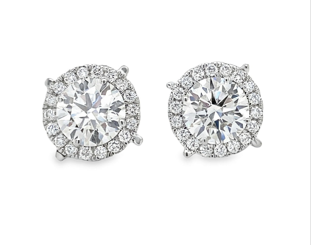 lab grown studs in halo setting in platinum